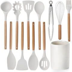 Wood handle kitchen utensils set with white heads and a white utensil holder.