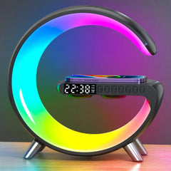 Colorful crescent-shaped LED clock with wireless phone charging on a table.